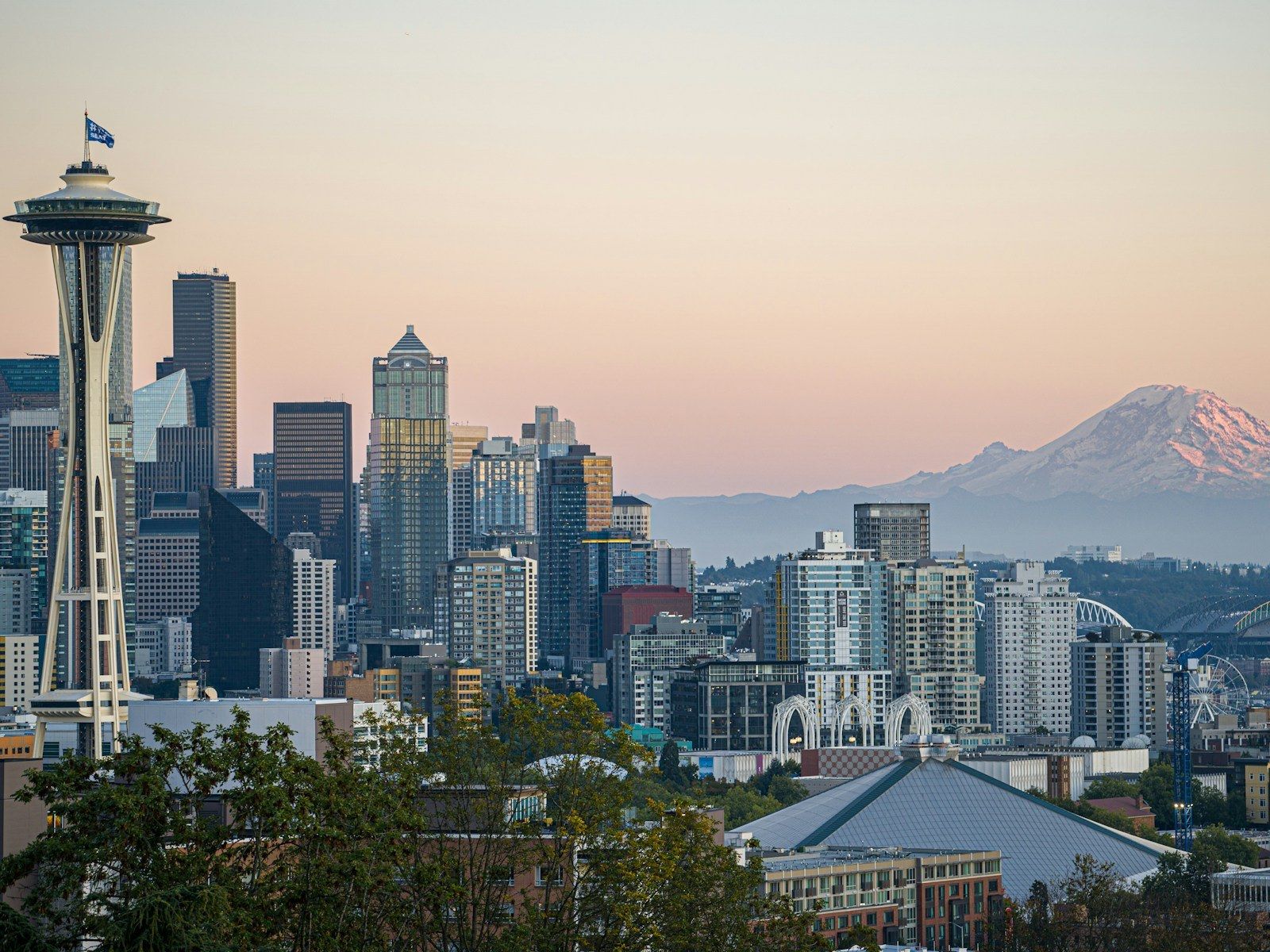 The Space Needle and Mount Rainier at dusk